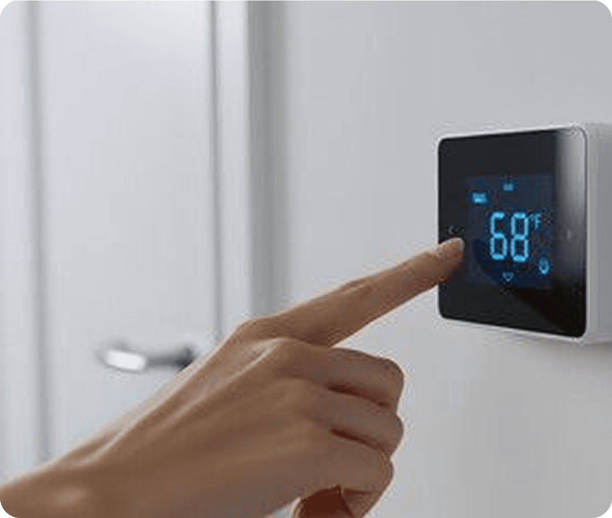 Finger adjusting digital thermostat temperature